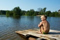 Little girl sits on a raft Royalty Free Stock Photo