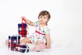 Little girl sits with three gift boxes. Royalty Free Stock Photo