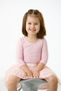 Little girl sitting on chair Royalty Free Stock Photo