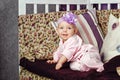 Little girl sitting on couch Royalty Free Stock Photo