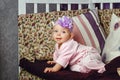 Little girl sitting on couch Royalty Free Stock Photo