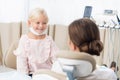 Little girl sitting in the dentists office Royalty Free Stock Photo