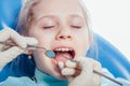 Little girl sitting in the dentists office Royalty Free Stock Photo