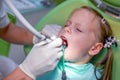 Little girl sitting in the dentists office Royalty Free Stock Photo