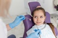 Little girl sitting in the dentists office Royalty Free Stock Photo