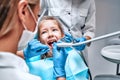 Little girl sitting in the dentists office Royalty Free Stock Photo