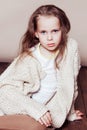 Little girl sitting on the floor and sad Royalty Free Stock Photo