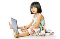 Little girl sitting on floor using a laptop Royalty Free Stock Photo