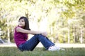 Little girl sitting on grass Royalty Free Stock Photo