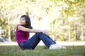 Little girl sitting on grass Royalty Free Stock Photo