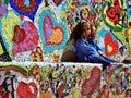 Little Girl Sitting on a Heart Mosaic Bench in a Park Royalty Free Stock Photo