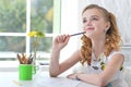 Little girl sitting at kitchen table and drawing Royalty Free Stock Photo