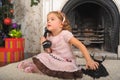 Little girl sitting next to a vintage  telephone Royalty Free Stock Photo