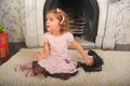 Little girl sitting next to a vintage  telephone Royalty Free Stock Photo