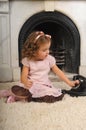 Little girl sitting next to a vintage  telephone Royalty Free Stock Photo