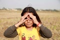 A little girl sitting in paddy field. Royalty Free Stock Photo