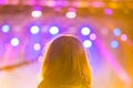 Little girl sitting on parents shoulders and looking at rock concert Royalty Free Stock Photo