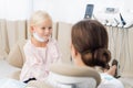 Little girl sitting and smiling in the dentists office. Child no Royalty Free Stock Photo