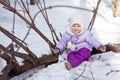 Little girl sitting in snow, walk