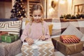 Girl opening Christmas presents Royalty Free Stock Photo