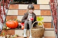 Little girl sitting on stairs outdoors