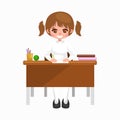 Little girl sitting at the table with notebooks and books, learning back to school concept