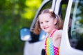 Little girl sitting in white car Royalty Free Stock Photo