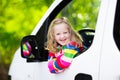 Little girl sitting in white car Royalty Free Stock Photo