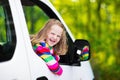 Little girl sitting in white car Royalty Free Stock Photo