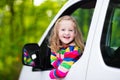 Little girl sitting in white car Royalty Free Stock Photo