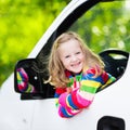 Little girl sitting in white car Royalty Free Stock Photo