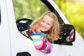 Little girl sitting in white car Royalty Free Stock Photo