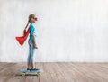 Little girl skating on a skateboard