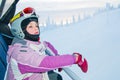 Little girl-skier on the ski lift