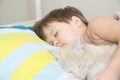 Little girl sleep with cat, favorite pet lying on child chest, Interactions between children and Cat Royalty Free Stock Photo