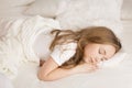 Little girl sleep in her bed. Background with bokeh Royalty Free Stock Photo