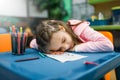 Little girl sleep in play area, pet shop Royalty Free Stock Photo