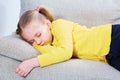 Little girl sleep on sofa in casual