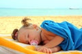 Little girl sleeping on beach Royalty Free Stock Photo