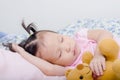 Little girl sleeping on bed Royalty Free Stock Photo