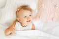 Little girl sleeping in bed in bedroom with crown. Princess birthday party. Royalty Free Stock Photo