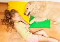 Little girl sleeping on her lovely dog's pillow Royalty Free Stock Photo