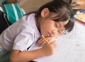 Little girl Sleeping Whilst Doing Homework. Royalty Free Stock Photo