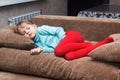 Little girl sleeps like a top on couch