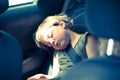 Little girl slepping on back seat Royalty Free Stock Photo