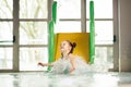 Little girl sliding down the water slide Royalty Free Stock Photo