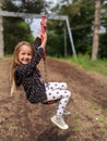 Little girl sliding down a zip wire Royalty Free Stock Photo