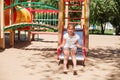 Little girl is sliding at playground Royalty Free Stock Photo