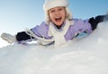 Little girl sliding in the snow Royalty Free Stock Photo