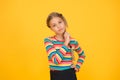 Little girl. Small child with cute braids hairstyle on yellow background. Child care concept. Preteen girl colorful